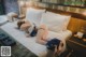 A woman laying on a bed in a hotel room.